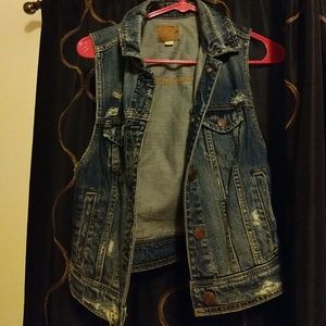 Distressed denim vest